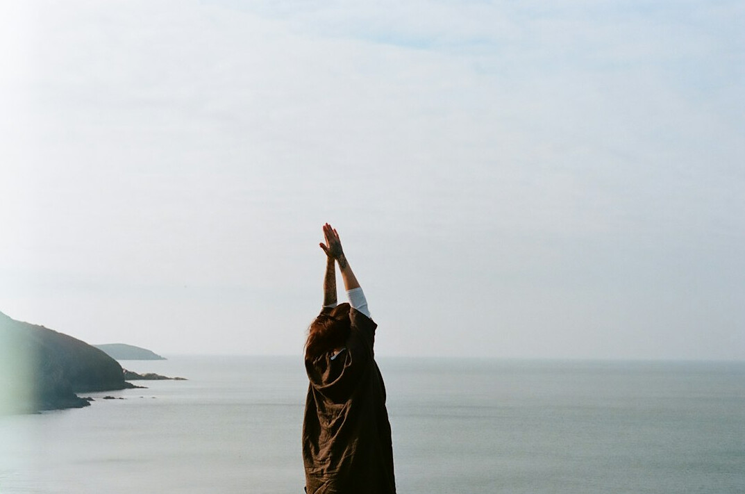 person meditating in nature