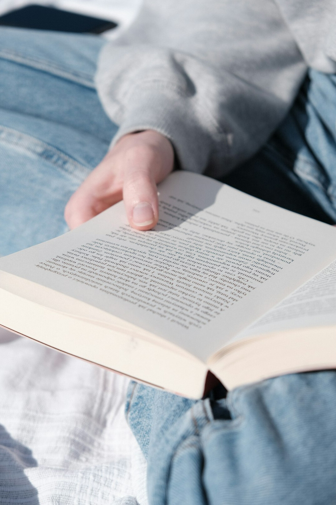 person reading self help book